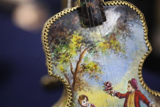 Two 20th century Viennese enamel musical boxes, in the form of a piano and a cello with stand, 6.5in. & 11.5in.